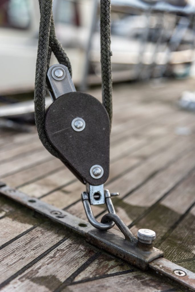 sailing yacht rigging equipment on wooden deck
