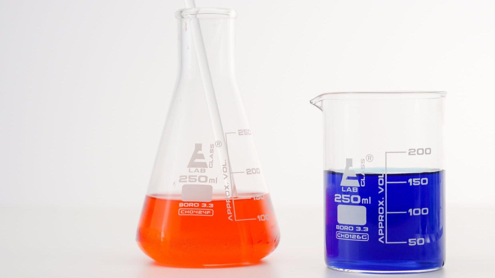 close up view of colorful liquids in laboratory glasswares
